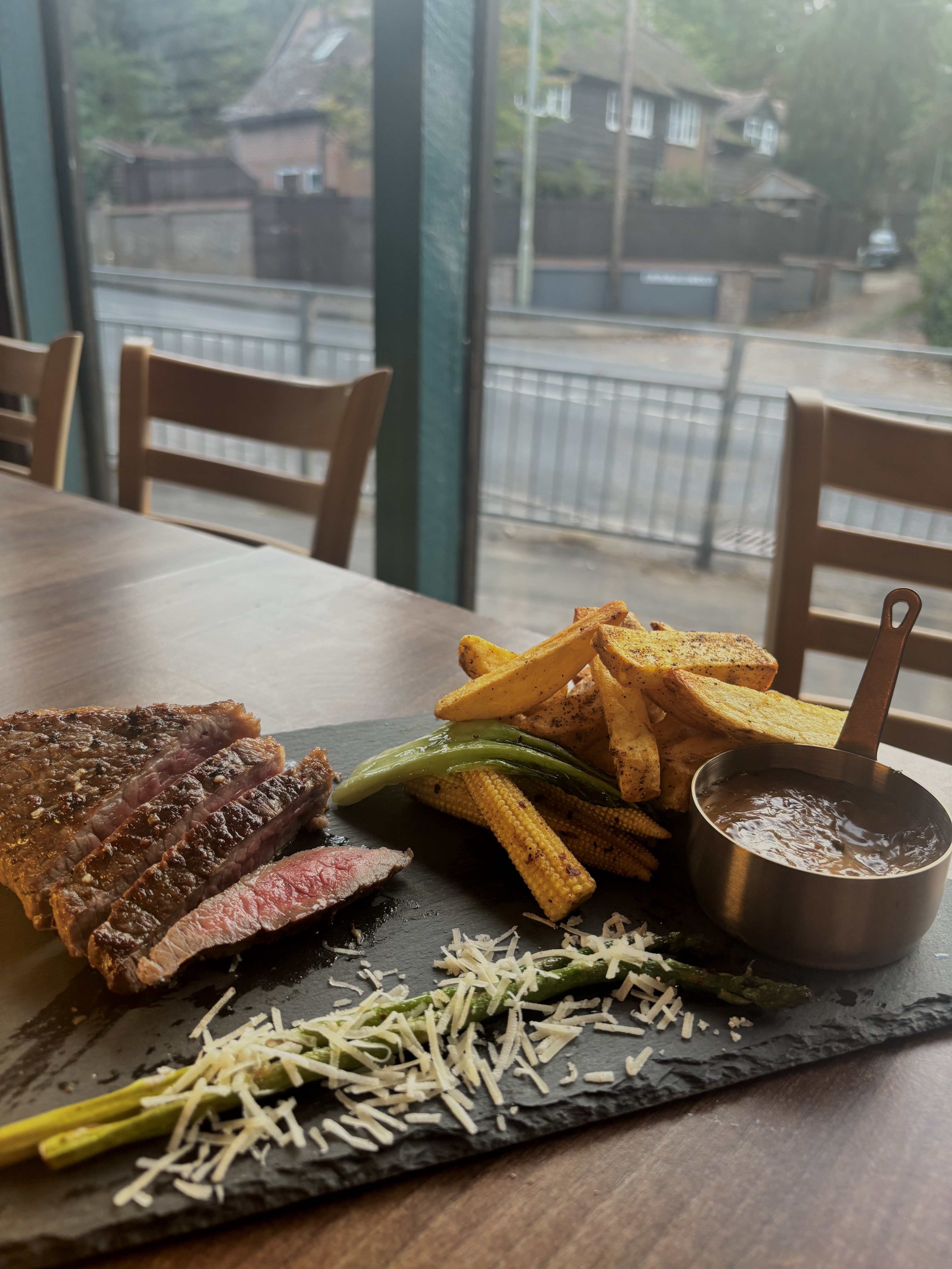 Sliced steak on a slate board at The Fox